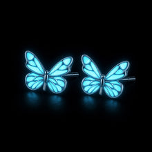 Boucles d'oreilles papillon Lumina — glow bleu fond noir